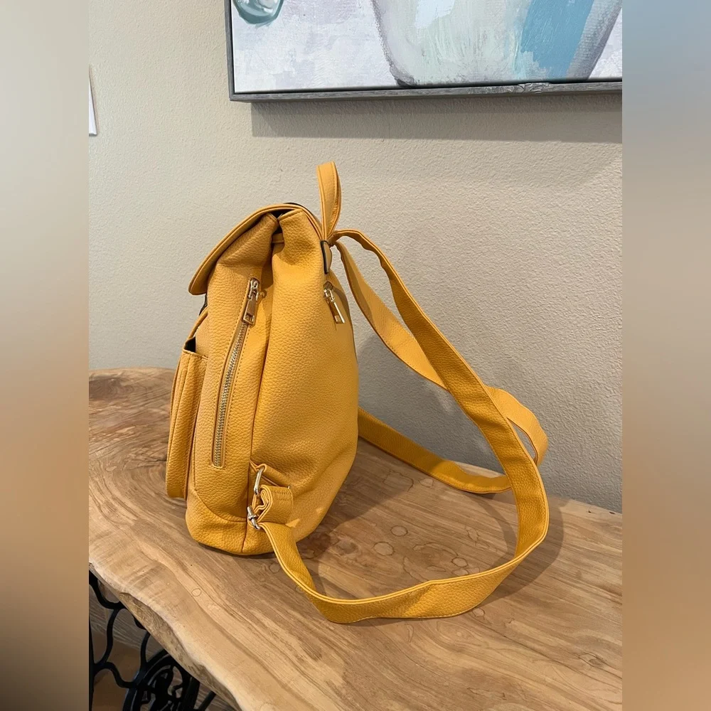 Yellow Textured Pleather Backpack with Silver Clasp
